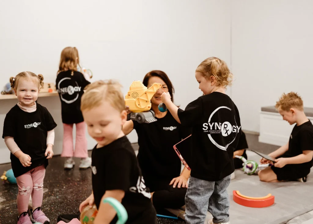 synergy rx kids zone home play Children playing with instructor at synergy rx kids zone