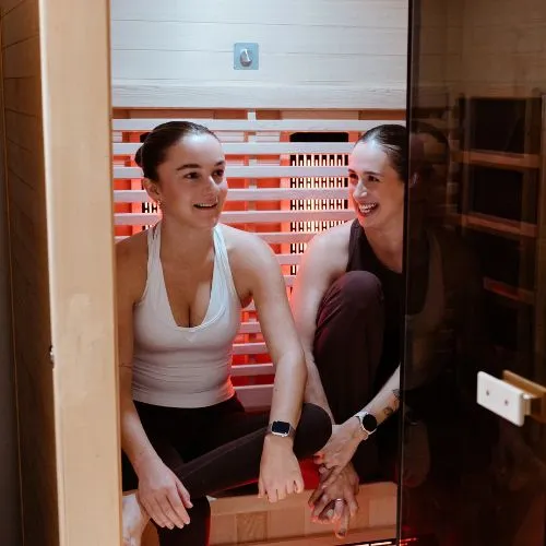 Two women in infra red sauna central coast